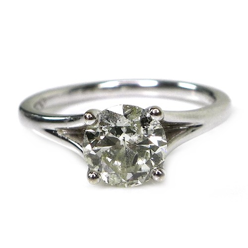 374 - An 18ct white gold and solitaire diamond ring, the round brilliant cut stone, 6.3mm by 3.6mm, 0.87ct... 