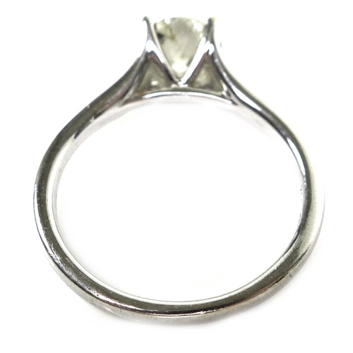 374 - An 18ct white gold and solitaire diamond ring, the round brilliant cut stone, 6.3mm by 3.6mm, 0.87ct... 