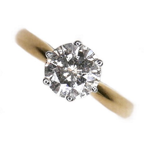 389 - An 18ct gold diamond solitaire ring, the round brilliant cut stone, 7.1mm diameter, 1.39ct, in a rai... 