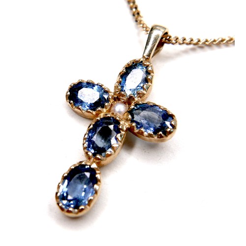 275 - A pale blue sapphire and pearl inlaid cross shaped pendant, set with a single pearl 18mm diameter, a... 