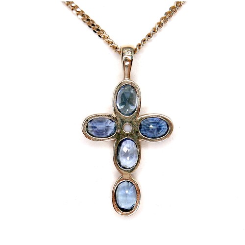 275 - A pale blue sapphire and pearl inlaid cross shaped pendant, set with a single pearl 18mm diameter, a... 