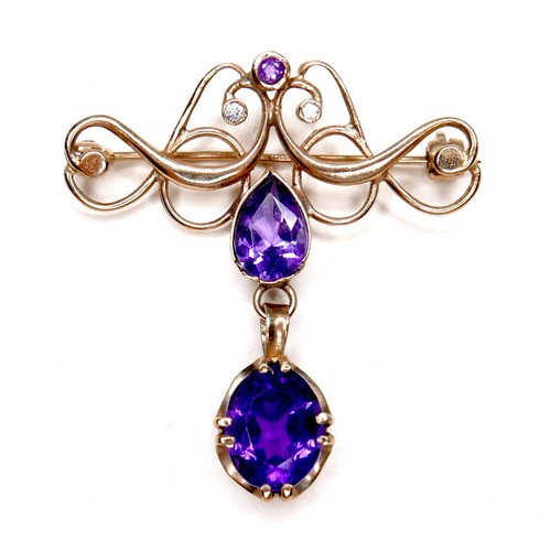 254 - An Edwardian 9ct gold amethyst and diamond brooch, largest amethyst 9mm by 7mm, a pear shaped cut am... 