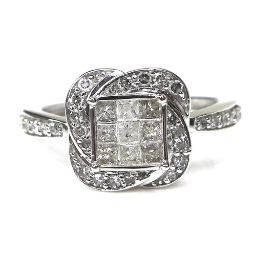 284 - A 9ct white gold and diamond dress ring, set with nine princess cut diamonds each of approximately 2... 