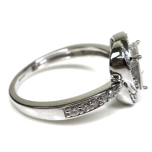 284 - A 9ct white gold and diamond dress ring, set with nine princess cut diamonds each of approximately 2... 