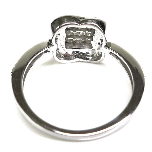 284 - A 9ct white gold and diamond dress ring, set with nine princess cut diamonds each of approximately 2... 