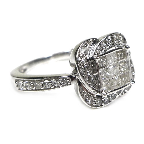 284 - A 9ct white gold and diamond dress ring, set with nine princess cut diamonds each of approximately 2... 