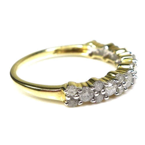 240 - A 9ct gold and diamond half eternity ring, the brilliant cut stones of varying size set in a bubble ... 