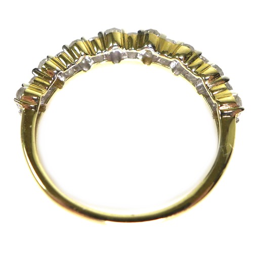 240 - A 9ct gold and diamond half eternity ring, the brilliant cut stones of varying size set in a bubble ... 