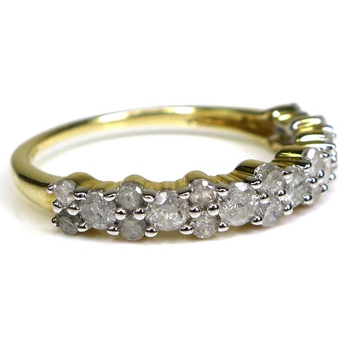 240 - A 9ct gold and diamond half eternity ring, the brilliant cut stones of varying size set in a bubble ... 