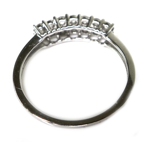 242 - A 9ct white gold and diamond ring, set with two rows of brilliant cut diamonds, size N/O, 1.9g.