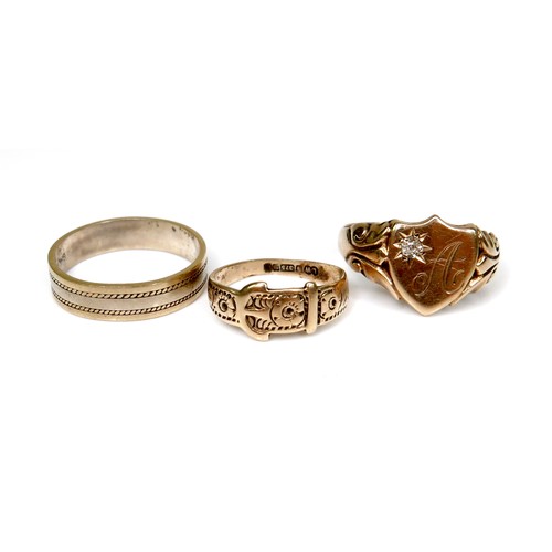 279 - A group of three gold rings, the first a 14ct bi-colour gentleman's ring, size T/V, 4.4g, the second... 