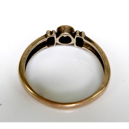 244 - A 9ct gold and white stone solitaire ring, of modern design with double banded shoulders and central... 