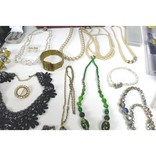 282 - A large collection of costume jewellery, including a silver bracelet with heart padlock charm, dress... 