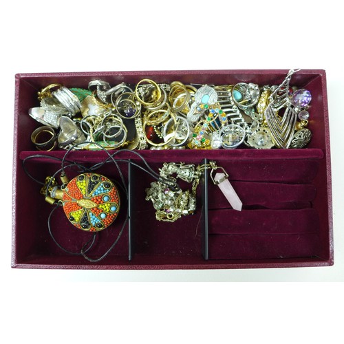 282 - A large collection of costume jewellery, including a silver bracelet with heart padlock charm, dress... 