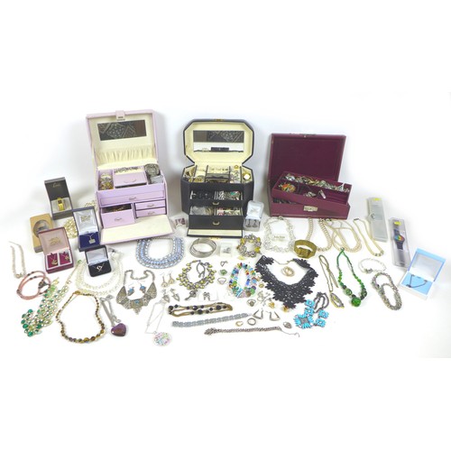 282 - A large collection of costume jewellery, including a silver bracelet with heart padlock charm, dress... 