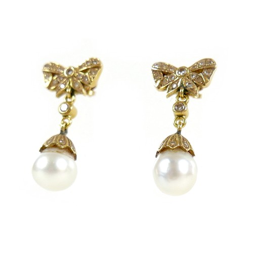 373 - A pair of 18ct gold and pearl drop earrings, early to mid 20th century, formed of bow design studs s... 