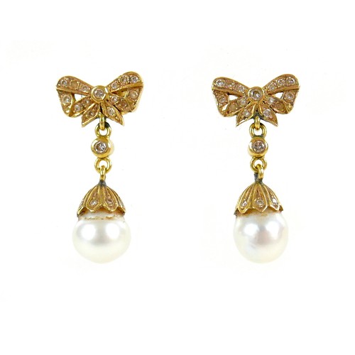 373 - A pair of 18ct gold and pearl drop earrings, early to mid 20th century, formed of bow design studs s... 