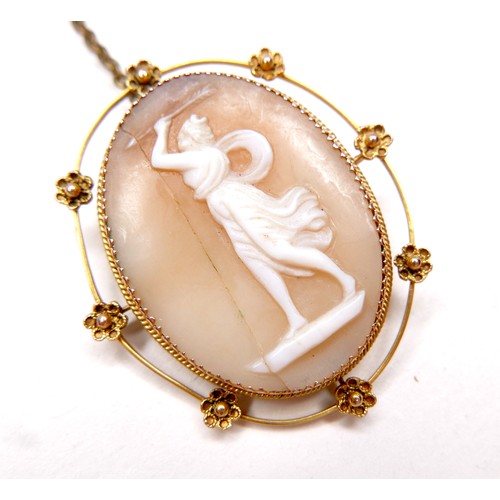 248 - A Victorian 9ct gold oval shaped cameo brooch, carved with a classical lady brandishing an arrow abo... 