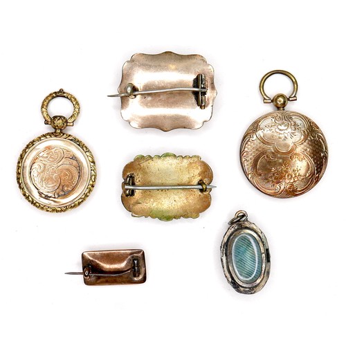 360 - A group of gold and yellow metal memorial jewellery, comprising two round lockets, each inset with a... 