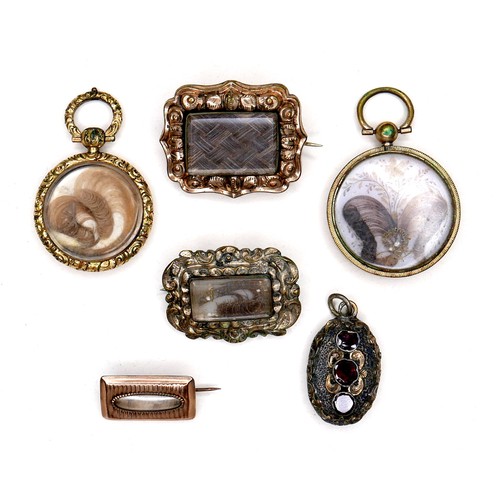 360 - A group of gold and yellow metal memorial jewellery, comprising two round lockets, each inset with a... 