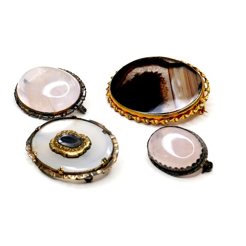 257 - A group of four 19th century brooches, comprising two Victorian brooches, one set with an oval black... 