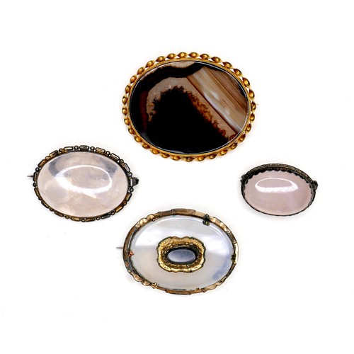 257 - A group of four 19th century brooches, comprising two Victorian brooches, one set with an oval black... 