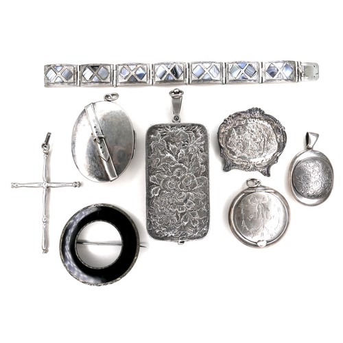 262 - A collection of silver brooches and pendants, including locket pendants, a cross pendant, and an Edw... 