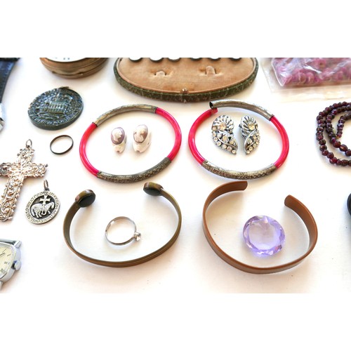 264 - A group of costume jewellery, including a string of pink hard stone beads, amethyst bead necklaces, ... 