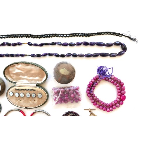 264 - A group of costume jewellery, including a string of pink hard stone beads, amethyst bead necklaces, ... 