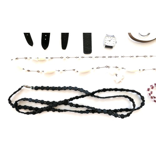 264 - A group of costume jewellery, including a string of pink hard stone beads, amethyst bead necklaces, ... 