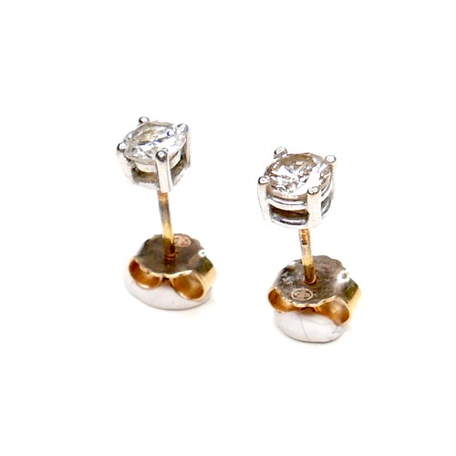 377 - A pair of diamond solitaire stud earrings, , each brilliant cut stone 4.9 by 3.4mm, 0.5ct, on 18ct w... 