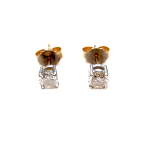 377 - A pair of diamond solitaire stud earrings, , each brilliant cut stone 4.9 by 3.4mm, 0.5ct, on 18ct w... 