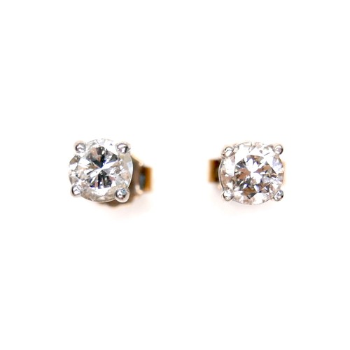 377 - A pair of diamond solitaire stud earrings, , each brilliant cut stone 4.9 by 3.4mm, 0.5ct, on 18ct w... 