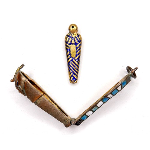 238 - An Egyptian revival silver and enamel locket, in the form of a sarcophagus, with hinged top revealin... 