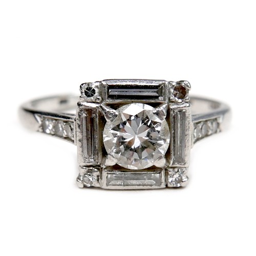 380 - An Art Deco white gold ring, set with brilliant cut diamond, 5.1 by 2.9mm, 0.48ct, surrounded by a s... 