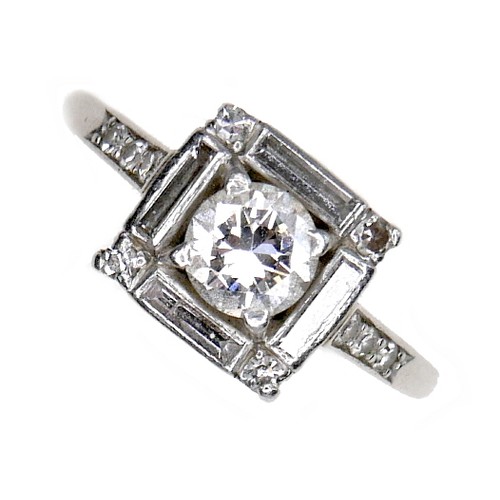 380 - An Art Deco white gold ring, set with brilliant cut diamond, 5.1 by 2.9mm, 0.48ct, surrounded by a s... 