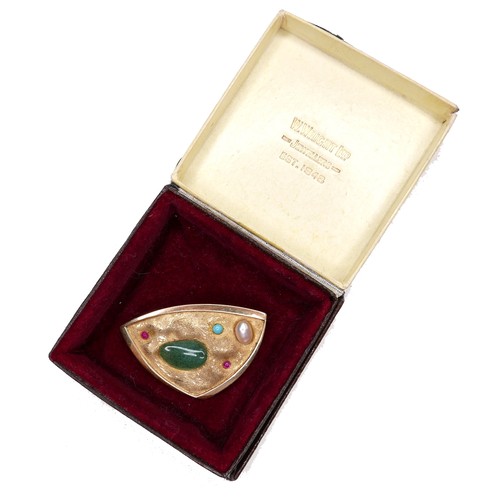 357 - An unmarked 18ct yellow gold brooch, of modernist triangular form, set randomly with jade, two rubie... 