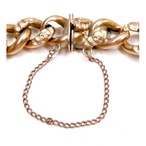 388 - A foreign 18ct yellow gold large curb link bracelet, press clasp and safety chain attached, tests as... 