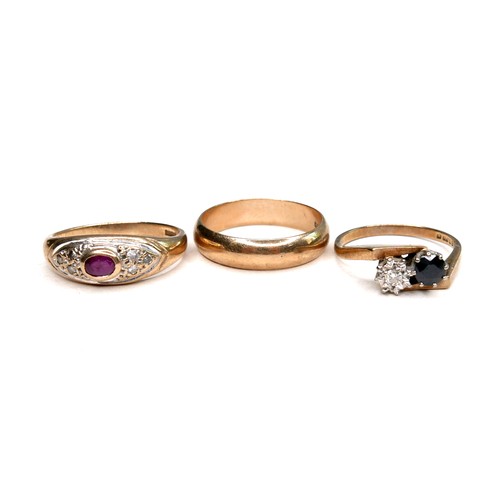 273 - Three 9ct gold rings, comprising a diamond and sapphire crossover ring, round cut sapphire, 4.5mm di... 