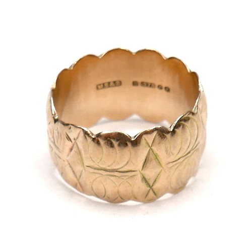 274 - A 9ct gold wide ring with scalloped edges and engraved design, size Q/R, 12mm wide, 7.4g.