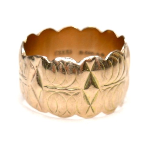 274 - A 9ct gold wide ring with scalloped edges and engraved design, size Q/R, 12mm wide, 7.4g.