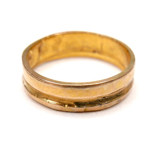 241 - A gold wedding band ring, formed from two separate thinner rings joined together, marks partially co... 