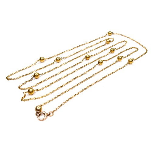 367 - An unmarked 18ct yellow gold guard chain necklace, formed of twelve spheres joined by lengths of cha... 