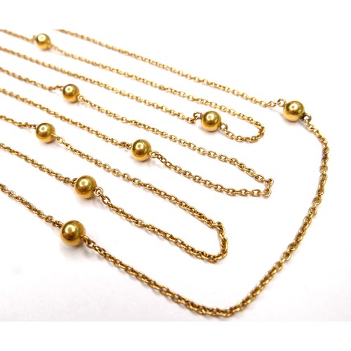 367 - An unmarked 18ct yellow gold guard chain necklace, formed of twelve spheres joined by lengths of cha... 