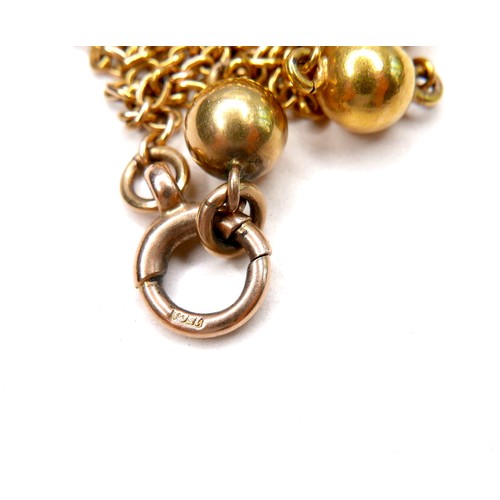 367 - An unmarked 18ct yellow gold guard chain necklace, formed of twelve spheres joined by lengths of cha... 