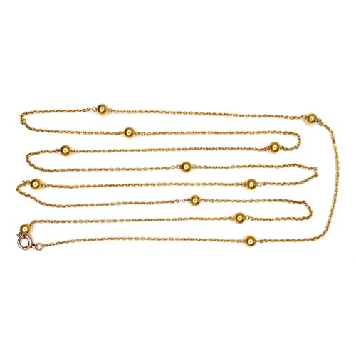 367 - An unmarked 18ct yellow gold guard chain necklace, formed of twelve spheres joined by lengths of cha... 