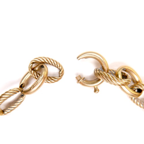 369 - An 18ct gold bracelet with large oval links, alternating plain and spiral design links, a/f ring cla... 