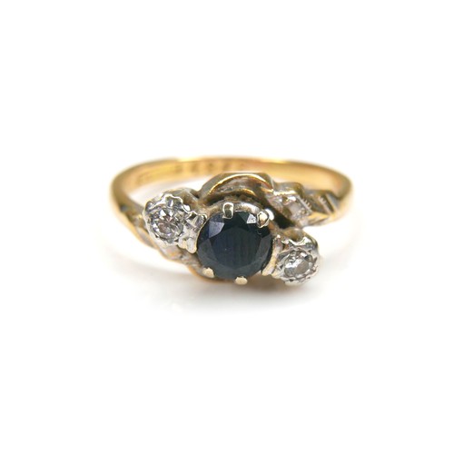 268 - An 18ct gold and platinum mounted sapphire and diamond ring, the central round cut sapphire, 4.7mm d... 