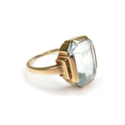 269 - A 14ct gold Aquamarine style stone ring, the emerald cut stone 13 by 10mm, the band stamped 585, L/M... 