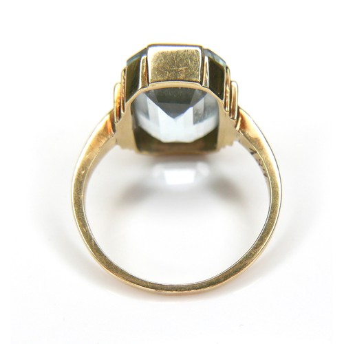 269 - A 14ct gold Aquamarine style stone ring, the emerald cut stone 13 by 10mm, the band stamped 585, L/M... 